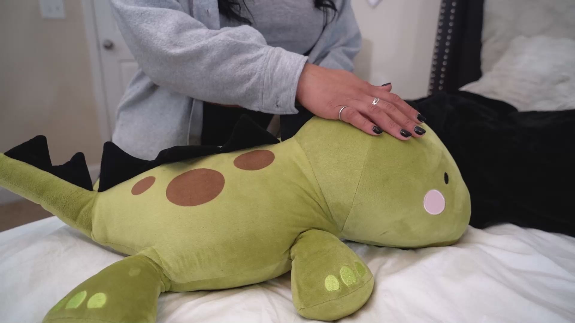 Spike is a soft, cuddly weighted dinosaur plushie.